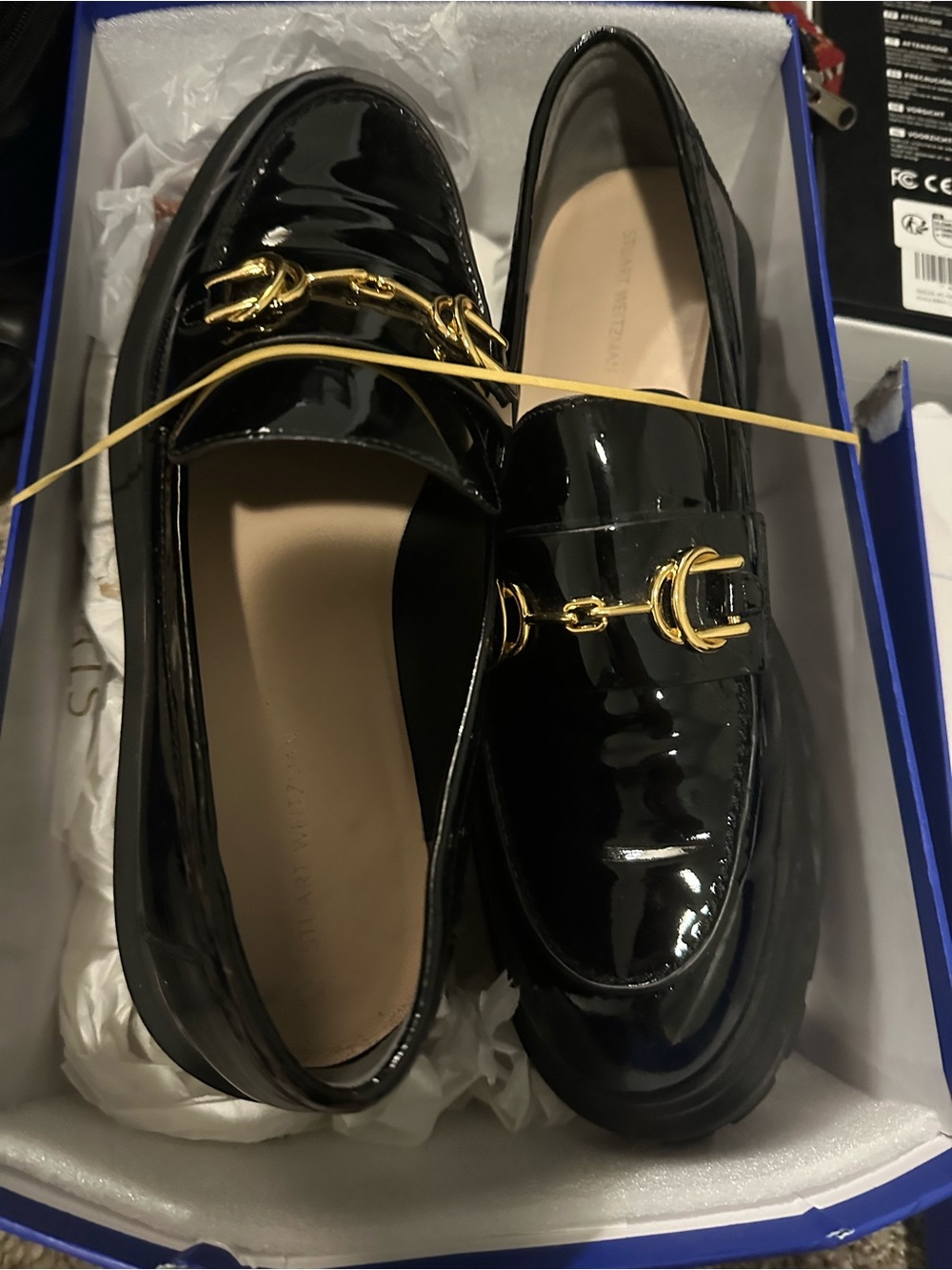 Stuart Weitzman Black Patent Leather Loafers with Gold Buckle
